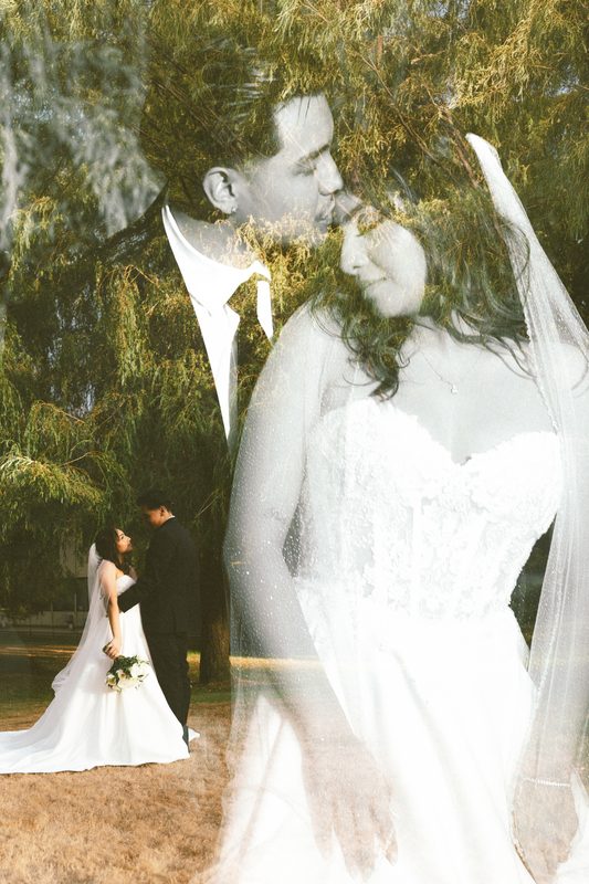 Double exposure of a kiss over a field