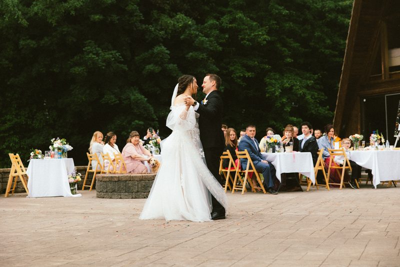 Bride and groom walking into their reception