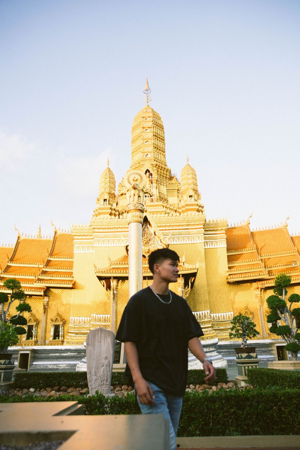Man in front of a golden temple
